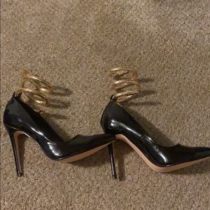 Stiletto black heels with snake ankle
